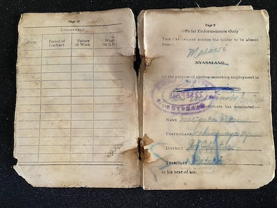 Alabi Mitawa's identity document, issued in 1966. Though two years after independence from Britain, the physical document still bears the colonial name Nyasaland and the district office stamp still bears the colonial name of Fort Johnston. Acquiring such a document was the first significant step on an aspirant's journey to enroll in WNLA's recruitment program